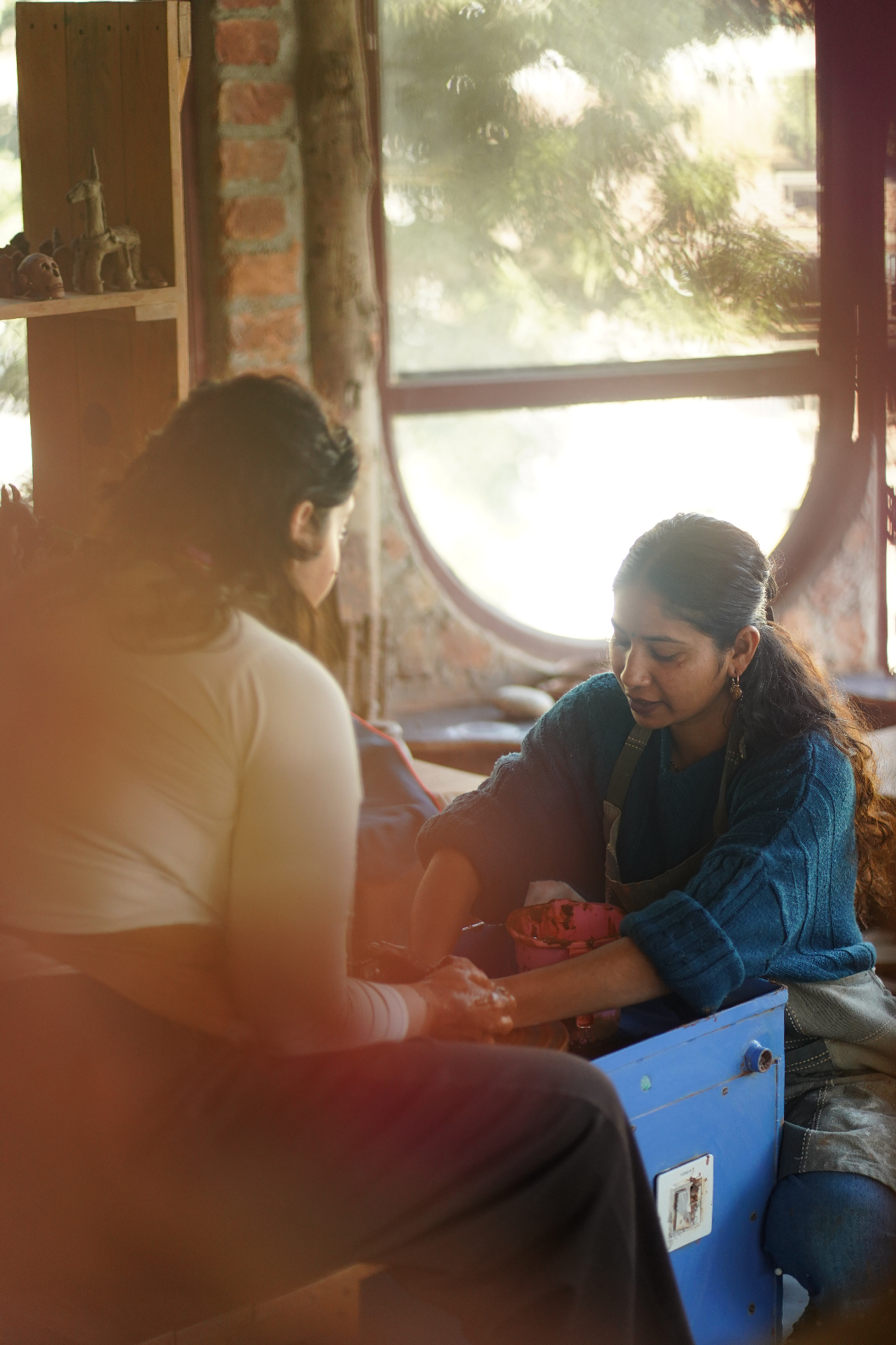 A couple working with clay in Aavya’s pottery studio, Rishikesh