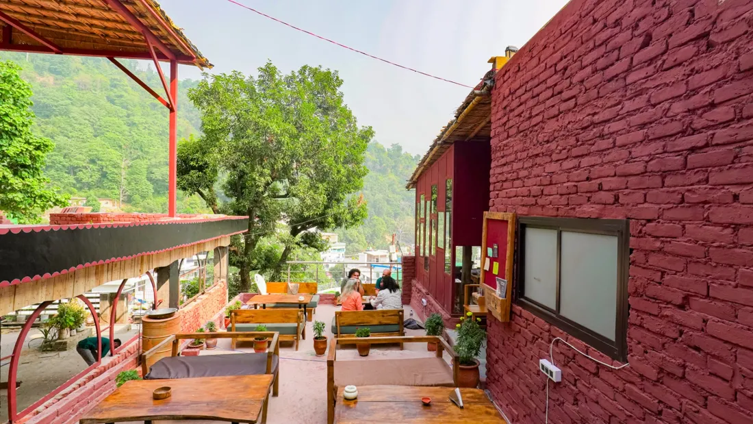 The sunny café terrace and mountain views at Aavya in Rishikesh
