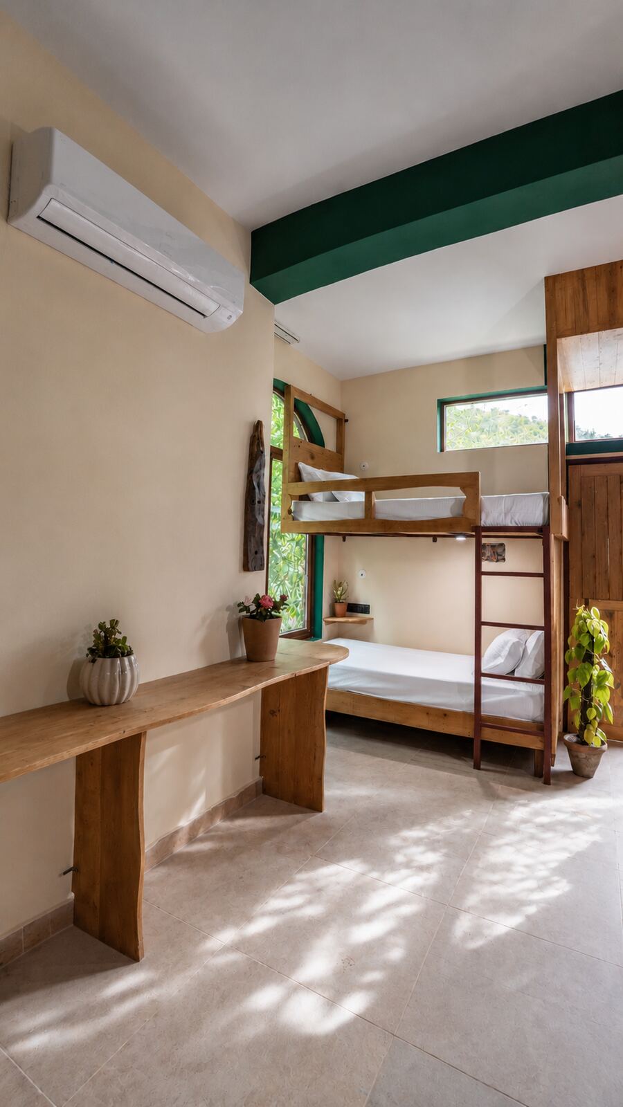 Bunk beds, plants and mountain-facing window in the Sleep Pod